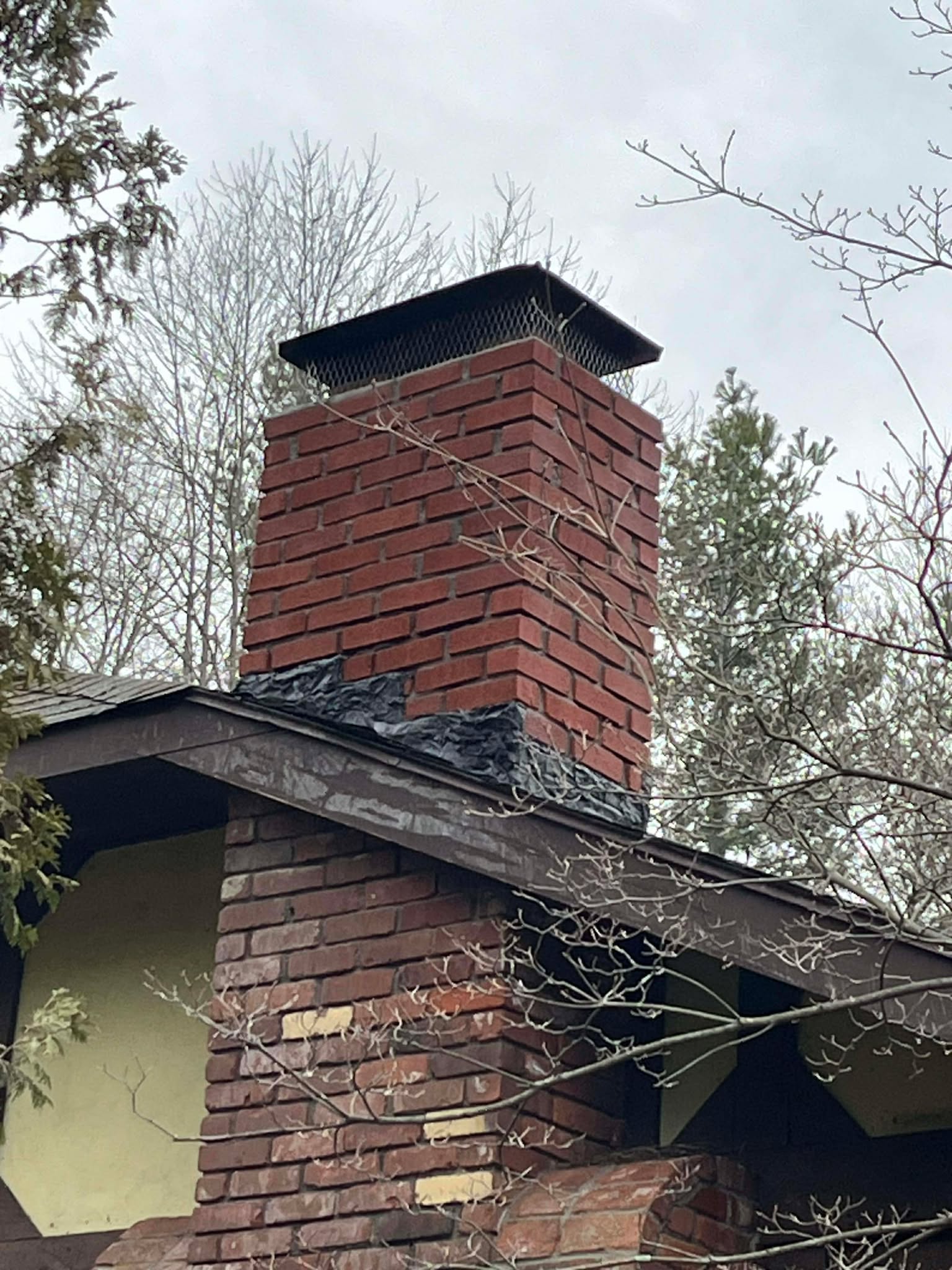 Chimney crown repair and waterproofing in Milton MA by Elite Chimney